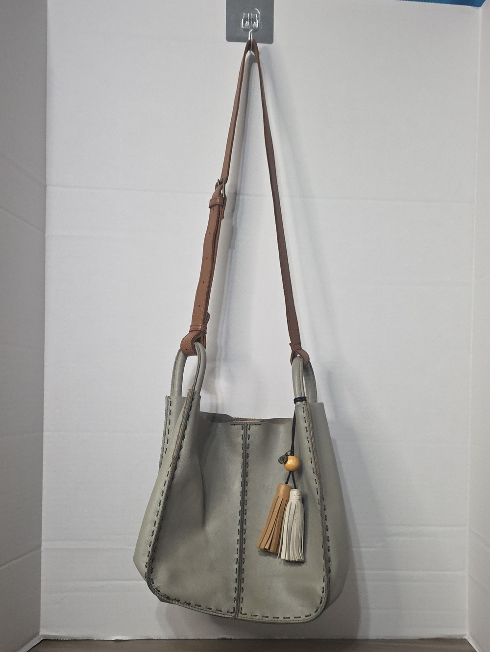 The Sak Los Feliz Mini Gray and Tan Crossbody Bag with Tassel